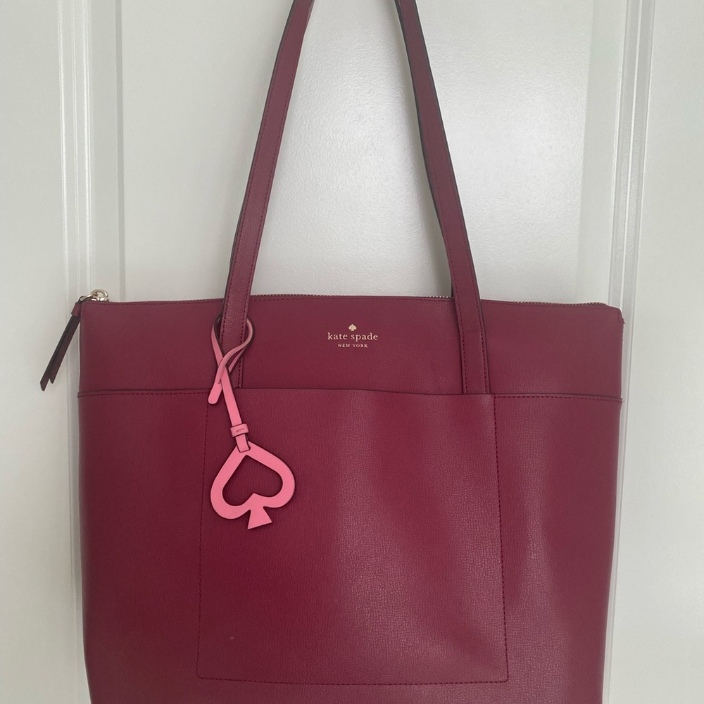 Kate SpadeTote.  Good condition… 15” x 11”. Few ink marks inside.  See photos